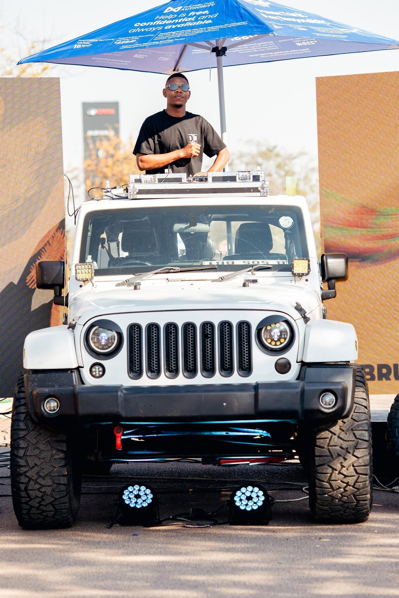 DJ playing from a rig mounted on a Jeep roof at a daytime Simply Piano activation