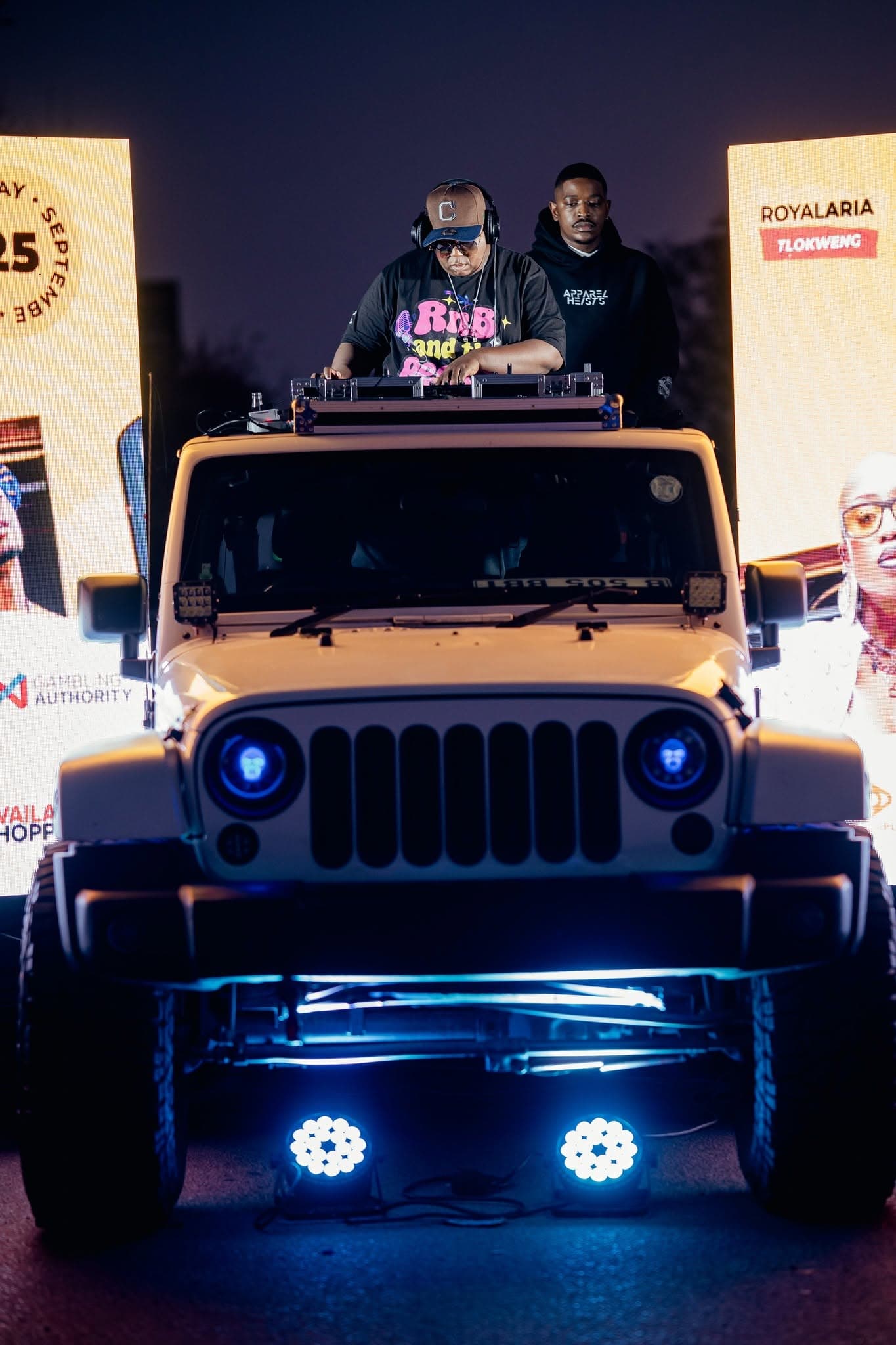 DJ rig lit up on a Jeep roof at a Simply Piano activation after dark