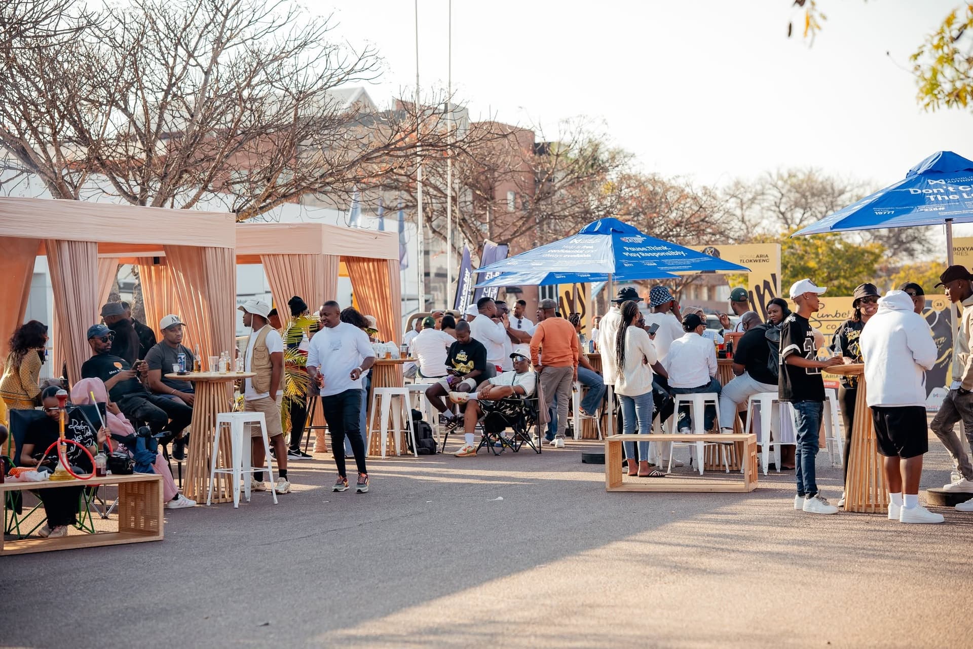 Attendees walking between stalls and gazebos at a Simply Piano roadshow