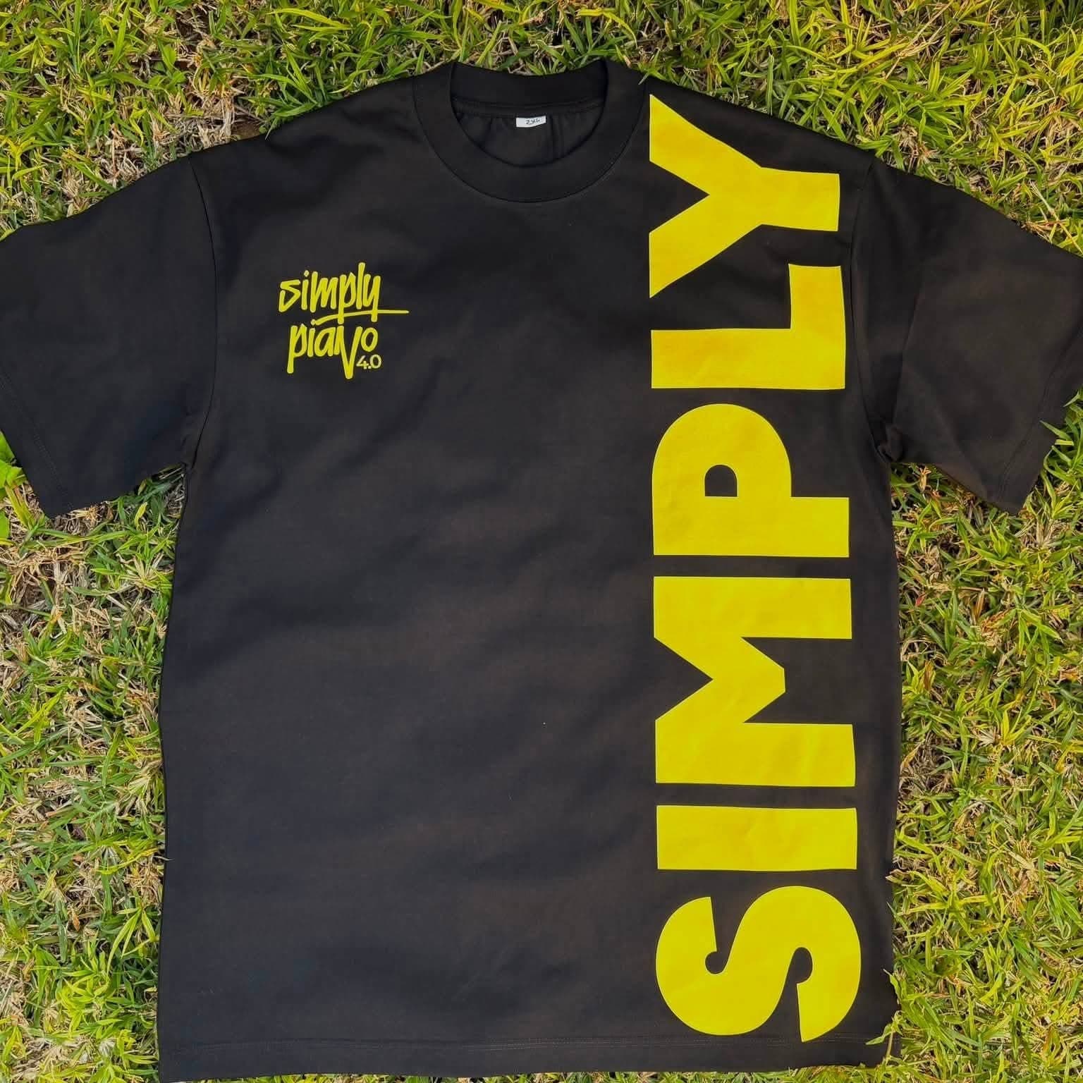 Black Simply Piano tee with a large yellow SIMPLY wordmark down the front